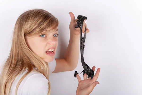 Adorable Girl Holding Black Slime Looks Gunk Making Faces — Stock Photo, Image