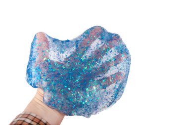 Transparent blue glitter slime on hand. Isolated on white background. clipart