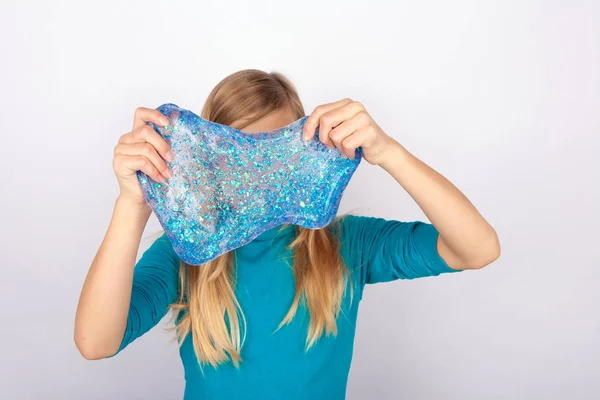 Young Girl Holdin Transparend Blue Glitter Slime Front Her Face — Stock Photo, Image