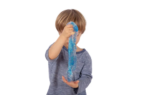 Söt Liten Pojke Leker Med Blå Glitter Slem Isolerad Vit — Stockfoto
