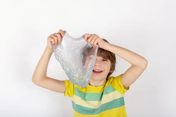 Cheerful Boy Holding Glitter Slime Front His Face — Stock Photo, Image