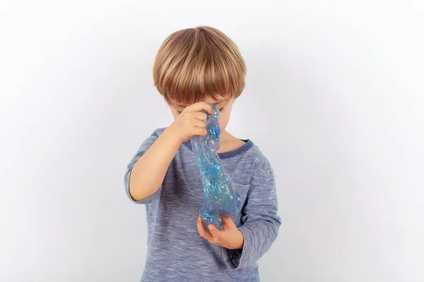 Funny Small Boy Playing Blue Glitter Slime Looks Gunk — Stock Photo, Image