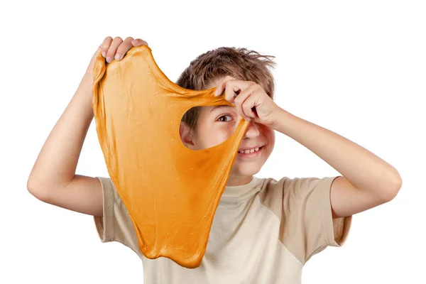 Cheerful boy holding a slime and looking throw its hole — Stock Photo, Image