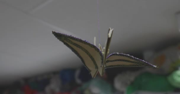 Paper crane hangs on a rope — Stock Video