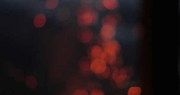 Bright and fiery bokeh on a black background — Stock Photo, Image