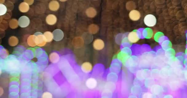 Feestelijke helder wazig bokeh. vage Kerstverlichting abstracte achtergrond — Stockvideo
