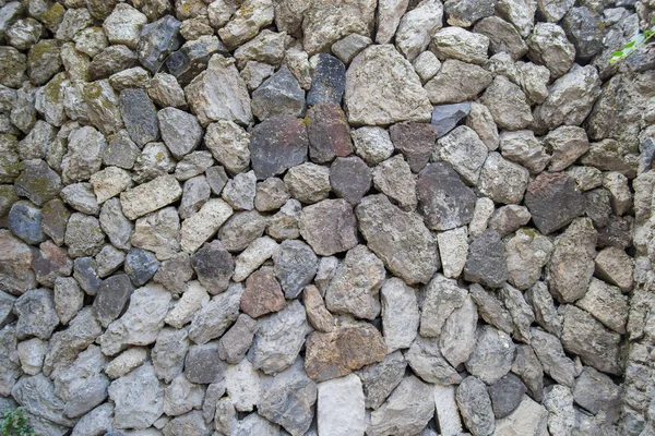 Texture del muro di pietra durante il giorno e la luce del giorno — Foto Stock