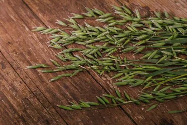 green oats on an old wooden table