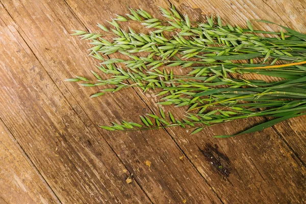 green oats on an old wooden table