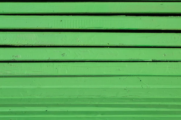 Horizontal background of green colored pieces of wood — Stock Photo, Image