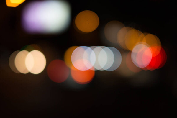 Abstract background of a blurry and colorful bokeh.