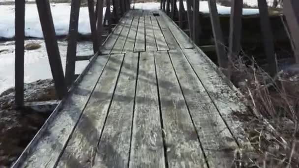 Old wooden bridge over the river — Stock Video