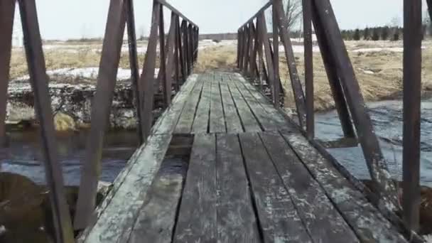 Old wooden bridge over the river — Stock Video