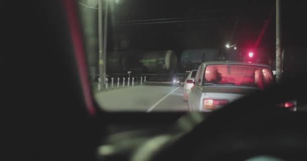 movement of the freight train at the crossing and the camera takes it out of the car