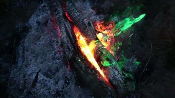 Fire and smoke in the light of a green laser slow motion video — Stock Video