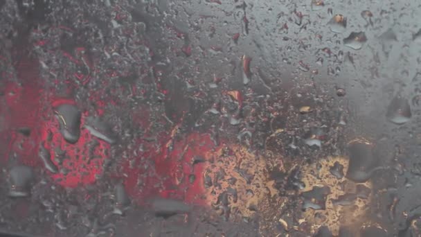 Raindrops on the car window close up — Stock Video