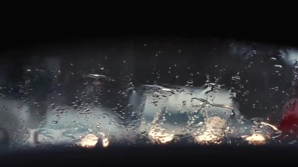 Raindrops on the car window close up — Stock Video