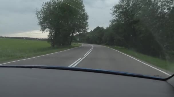 Car trip on country roads on a summer day. handheld camera shooting from the cab — Stock Video