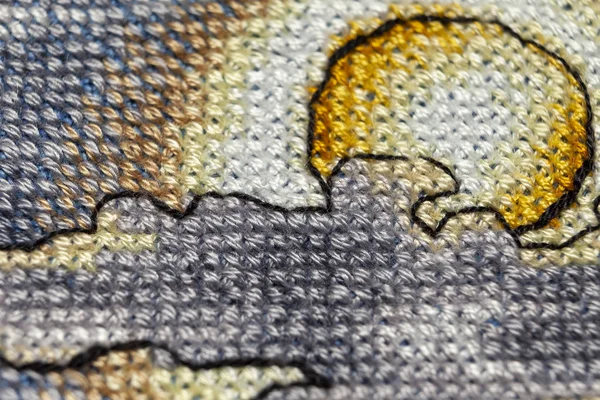 Kanaviçe işi. Makro fotoğrafçılık nakış siteleri. Netlik küçük bir blöf ile ateş. Tuval üzerinde parlak desenleri.