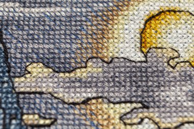 Kanaviçe işi. Makro fotoğrafçılık nakış siteleri. Netlik küçük bir blöf ile ateş. Tuval üzerinde parlak desenleri.