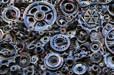 Steampunk arka plan, makine parçaları, büyük dişli ve zincir makineleri ve traktörler. Eski paslı makine parçaları. Yaylar, rulmanlar, pistonlar, milleri, milleri.