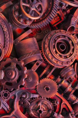 Steampunk arka plan, makine parçaları, büyük dişli ve zincir makineleri ve traktörler. Eski paslı makine parçaları. Yaylar, rulmanlar, pistonlar, milleri, milleri.