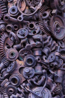 Steampunk arka plan, makine parçaları, büyük dişli ve zincir makineleri ve traktörler. Eski paslı makine parçaları. Yaylar, rulmanlar, pistonlar, milleri, milleri.