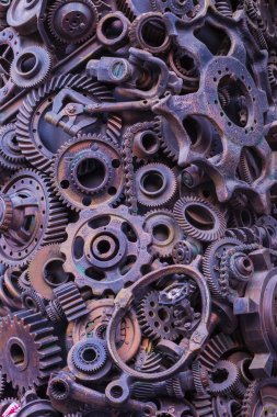 Steampunk arka plan, makine parçaları, büyük dişli ve zincir makineleri ve traktörler. Eski paslı makine parçaları. Yaylar, rulmanlar, pistonlar, milleri, milleri.