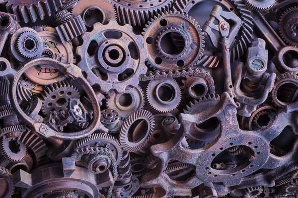 Steampunk arka plan, makine parçaları, büyük dişli ve zincir makineleri ve traktörler. Eski paslı makine parçaları. Yaylar, rulmanlar, pistonlar, milleri, milleri.