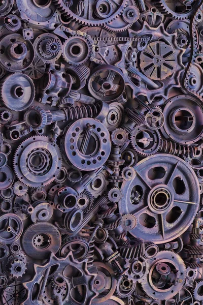 Steampunk arka plan, makine parçaları, büyük dişli ve zincir makineleri ve traktörler. Eski paslı makine parçaları. Yaylar, rulmanlar, pistonlar, milleri, milleri.