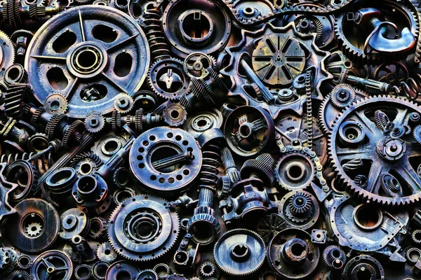 Steampunk arka plan, makine parçaları, büyük dişli ve zincir makineleri ve traktörler. Eski paslı makine parçaları. Yaylar, rulmanlar, pistonlar, milleri, milleri.