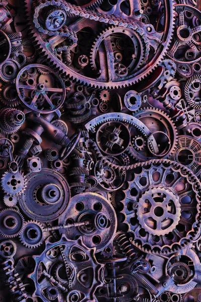 Steampunk arka plan, makine parçaları, büyük dişli ve zincir makineleri ve traktörler. Eski paslı makine parçaları. Yaylar, rulmanlar, pistonlar, milleri, milleri.