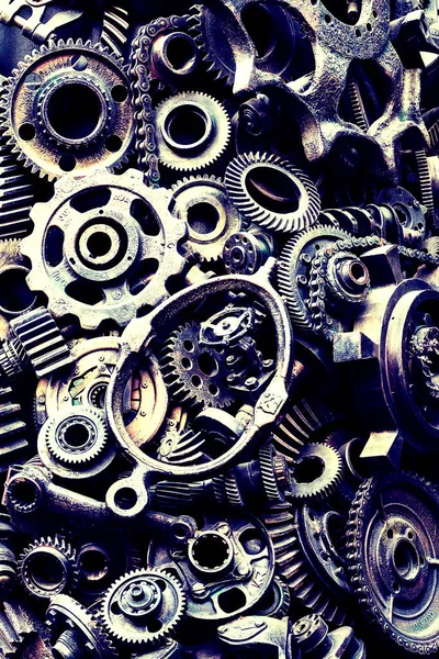 Steampunk texture, backgroung with mechanical parts, gear wheels, steam punk cogwheels, heap of auto parts, old rusty iron chains, springs, wheels, close up
