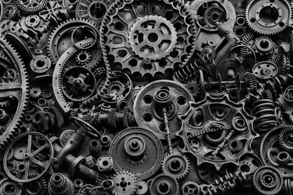 Steampunk texture, backgroung with mechanical parts, gear wheels, steam punk cogwheels, heap of auto parts, old rusty iron chains, springs, wheels, close up