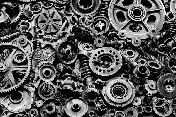 Steampunk background, machine parts, large gears and chains from machines and tractors. Old rusty machine and mechanical parts. Springs, bearings, pistons, crankshafts, camshafts.