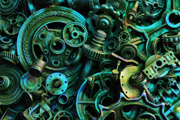 Steampunk background, machine parts, large gears and chains from machines and tractors. Old rusty machine and mechanical parts. Springs, bearings, pistons, crankshafts, camshafts.