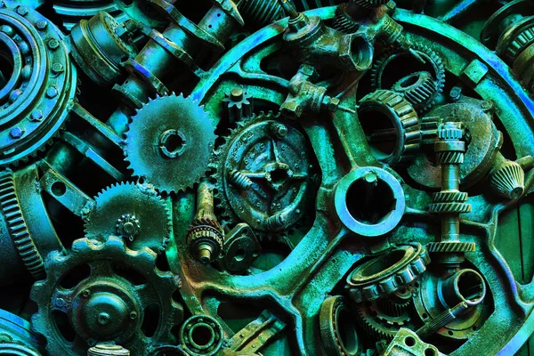 Steampunk background, machine parts, large gears and chains from machines and tractors. Old rusty machine and mechanical parts. Springs, bearings, pistons, crankshafts, camshafts.