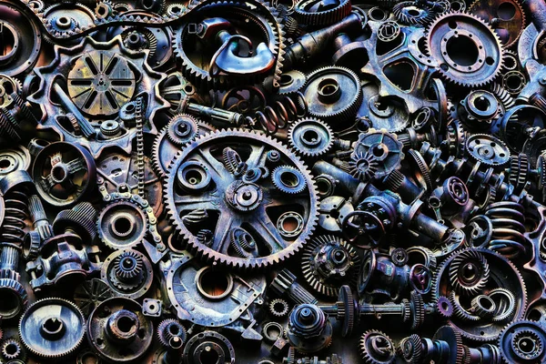 Steampunk texture, backgroung with mechanical parts, gear wheels, steam punk cogwheels, heap of auto parts, old rusty iron chains, springs, wheels, close up