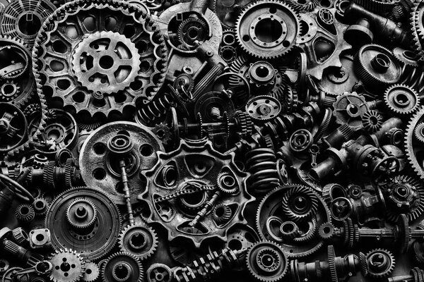 Steampunk texture, backgroung with mechanical parts, gear wheels, steam punk cogwheels, heap of auto parts, old rusty iron chains, springs, wheels, close up