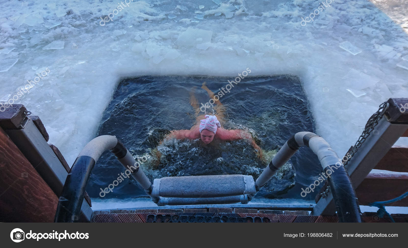 Person Emerging Swimming Hole Cut Frozen Ice Surface Lake Viewed