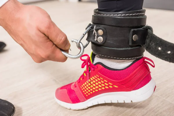 Hand Attaching Metal Carabiner Clip Black Leather Ankle Support Womans — Stock Photo, Image