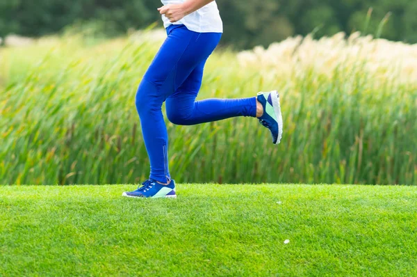 Lower Body Woman Sprinting Park Alongside Reeds Shore Lake She — Stock Photo, Image