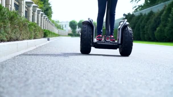 Low angle view of the wheels of a Electric Personal Transporter — Stock Video