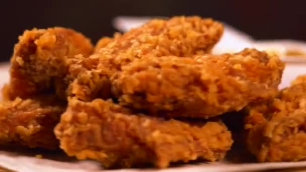 Bite sized portions of fried fish or chicken — Stock Video