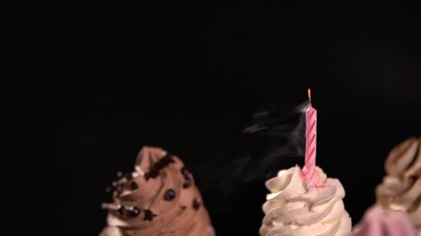 Smoking extinguished candle on a party cupcake — Stock Video