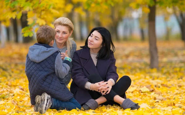 Same Sex Female Couple Listening Son Intently Autumn Park Setting — Stock Photo, Image