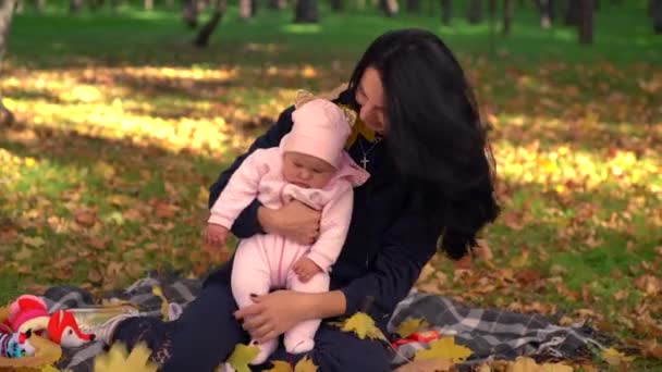 Happy mother with her baby child in park — Stock Video