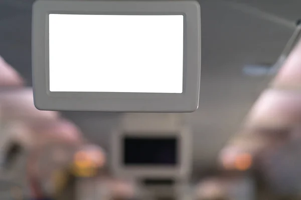 Blank white television screen on an aircraft in a close up view in an entertainment and travel concept
