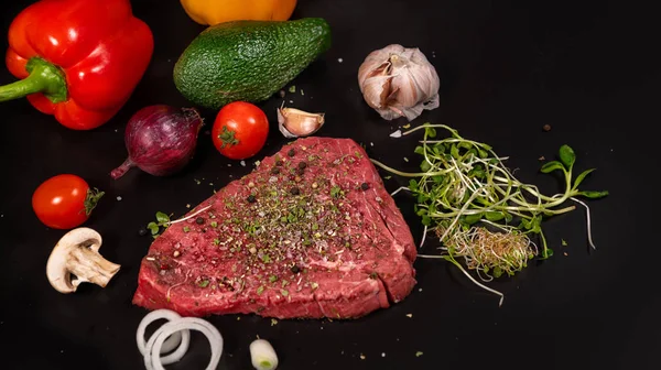 Fresh raw beef steak with seasoning — Stock Photo, Image