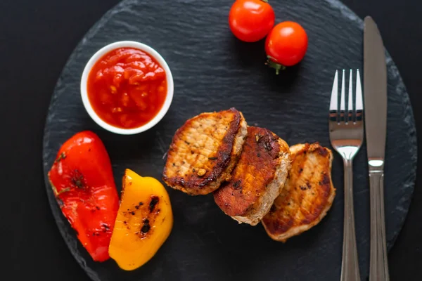 Grilled pork fillet with roast bell peppers — Stock Photo, Image